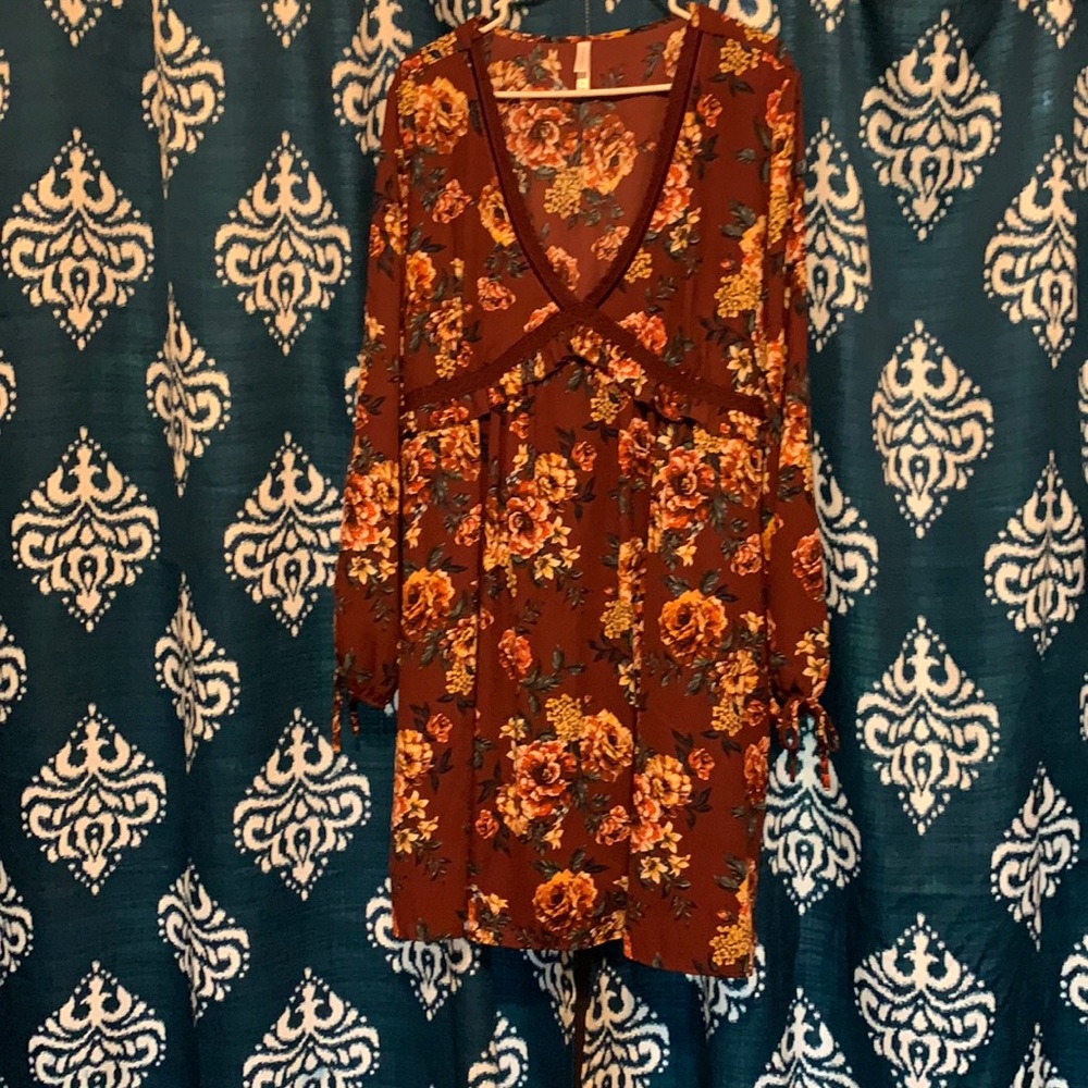 Knee length, long sleeve, maroon, floral dress.